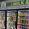 The milk cooler fully stocked at Lane Co. Community Grocery during their grand opening in June 2026