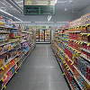 An aisle with canned goods fully stocked for Lane Co. Community Grocery's grand opening in June 2026